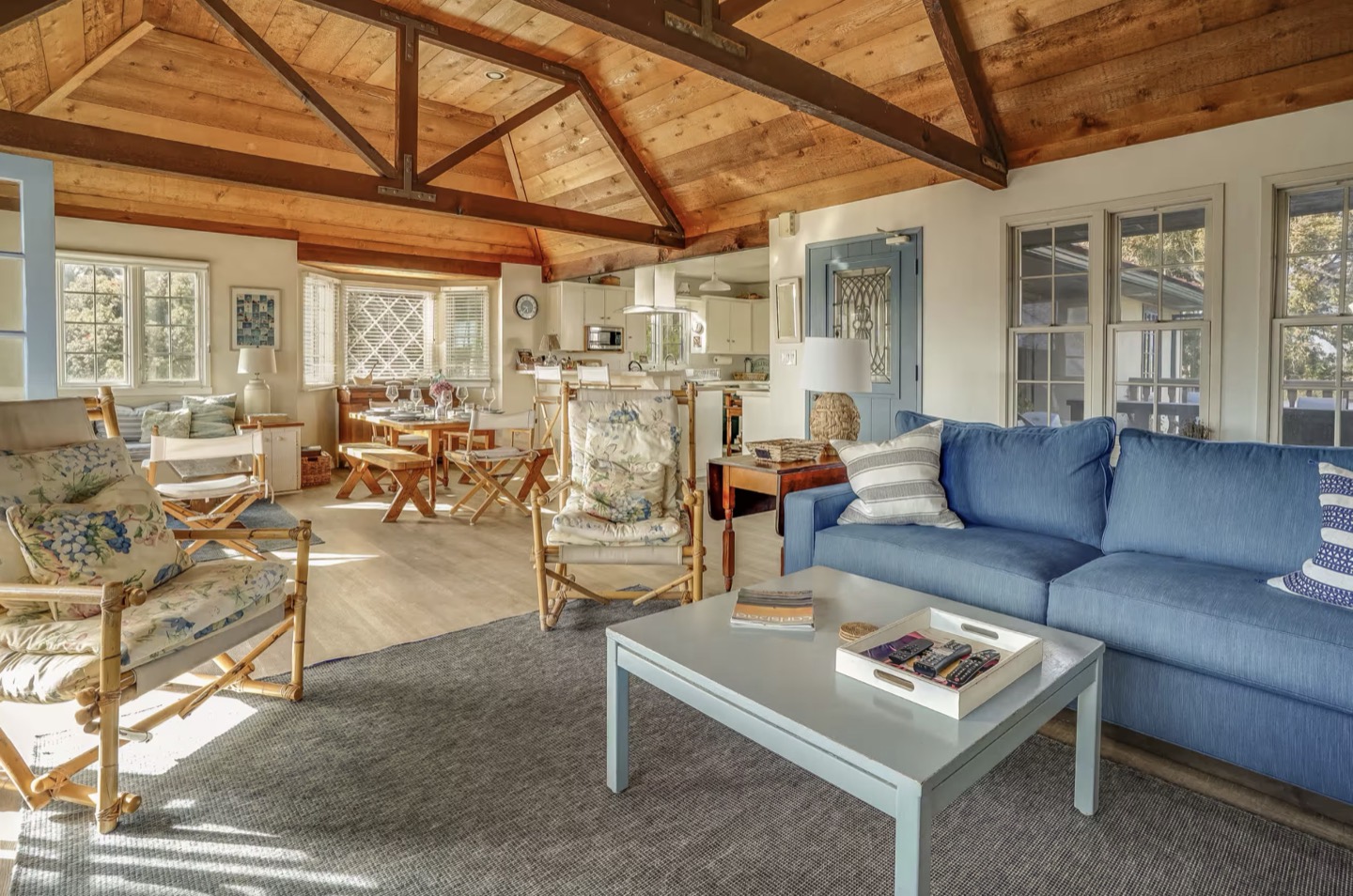 The family room under open beams, light coming in from three sides