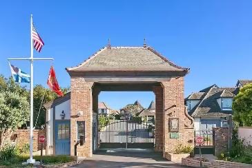 The brick St. Malo gatehouse with flags flying