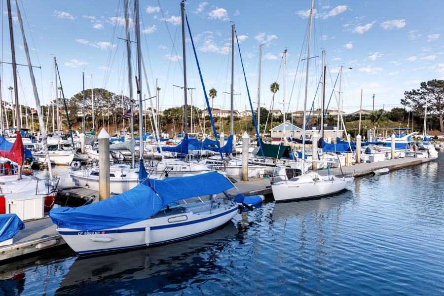 Sailboats moored along the docks at Oceanside Harbor