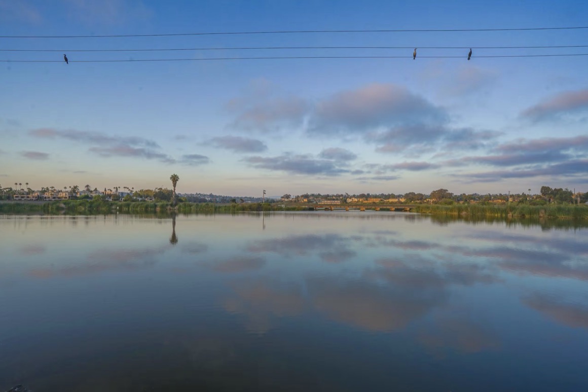 Buena Vista Lagoon at first light, still water reflecting the sky